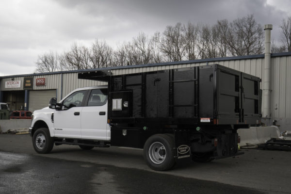 9'6" Heavy-Duty Landscape Body, Removable Sides, Integrated Custom Toolbox, Full Cab Shield, Double-Acting Hoist, Adjustable Hitch Slide Track on Pull Plate, Underbody Toolboxes
